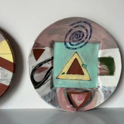 1980's Postmodern Larry H. Hand Painted Wall Art Plates - A Pair -chairish shop 1980s postmodern larry h hand painted wall art plates a pair 9668 scaled