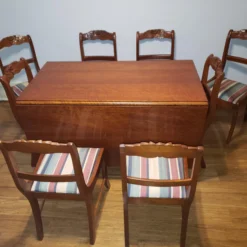 Antique 1920's Drop Leaf Table With Eight Hand Carved Rose Back Wood Chairs - 9 Piece Set -chairish shop antique 1920s drop leaf table with eight hand carved rose back wood chairs 9 piece set 0565 scaled