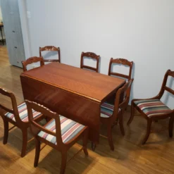 Antique 1920's Drop Leaf Table With Eight Hand Carved Rose Back Wood Chairs - 9 Piece Set -chairish shop antique 1920s drop leaf table with eight hand carved rose back wood chairs 9 piece set 6223 scaled